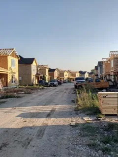 Residential construction site with fewer active projects, indicating a slowdown in housing starts.