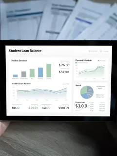 Person reviewing student loan repayment benefits on tablet