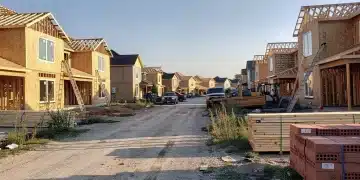 Residential construction site with fewer active projects, indicating a slowdown in housing starts.